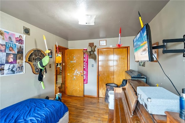 bedroom with hardwood / wood-style floors