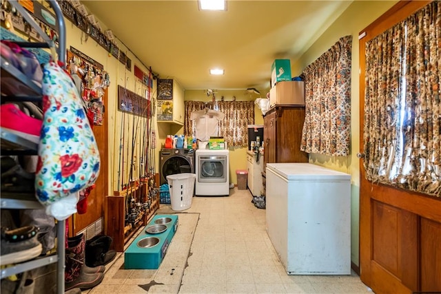 laundry room featuring washing machine and clothes dryer