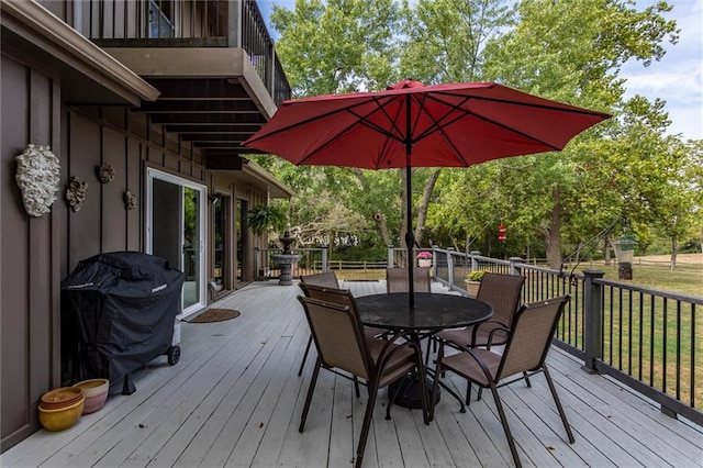 wooden terrace with a grill