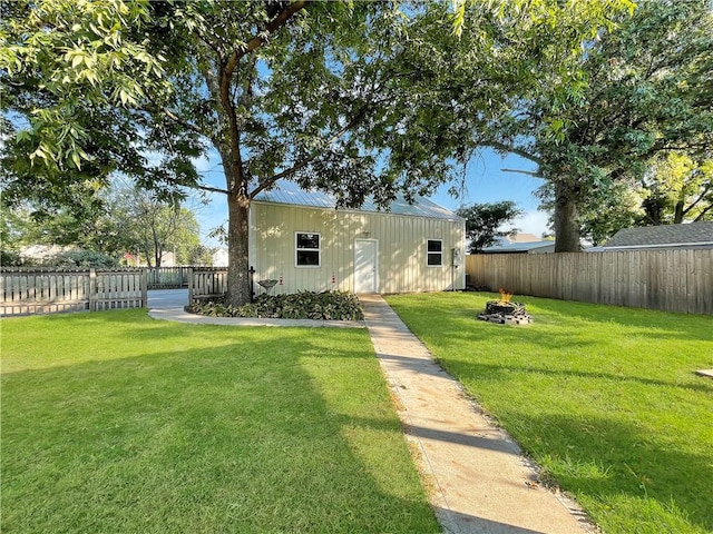 exterior space featuring an outdoor fire pit