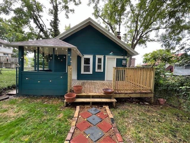 back of property featuring a deck