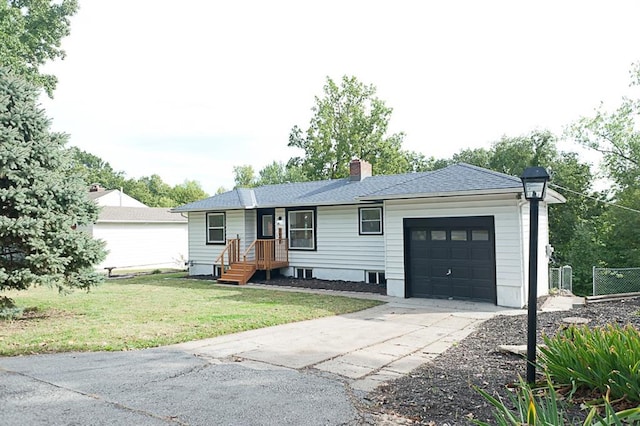 ranch-style house with a front lawn and a garage