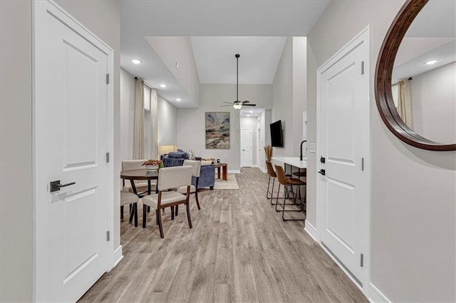 dining space featuring light hardwood / wood-style flooring and ceiling fan