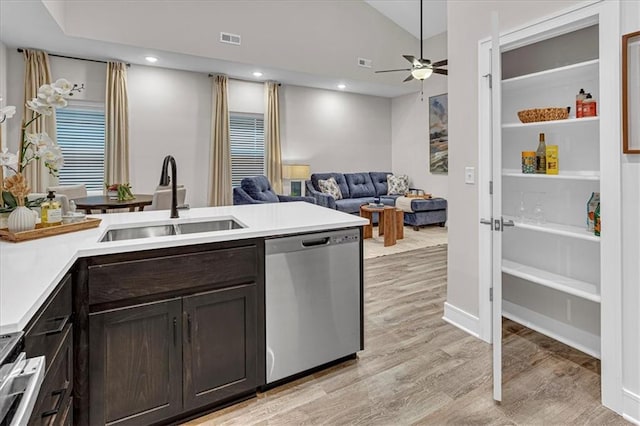 kitchen featuring dark brown cabinets, ceiling fan, sink, dishwasher, and light hardwood / wood-style floors