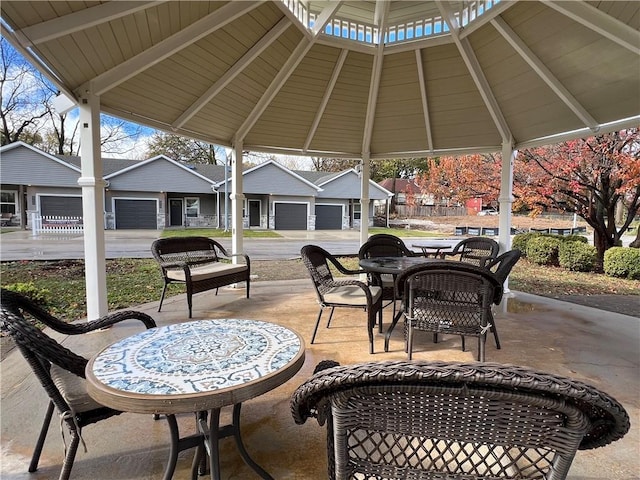 view of patio with a gazebo and a garage