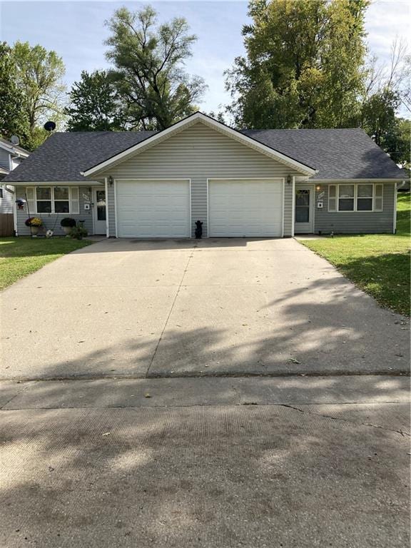 ranch-style house with a front lawn and a garage