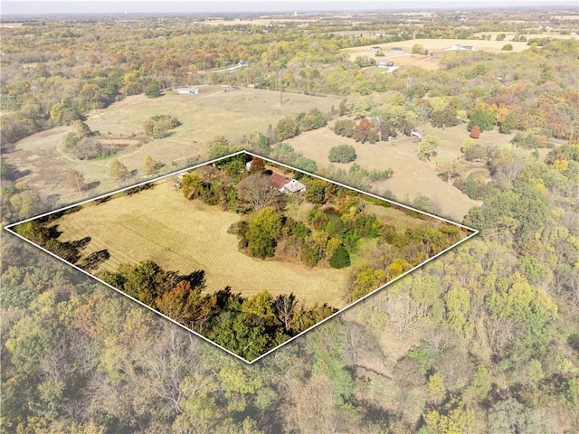 birds eye view of property with a rural view