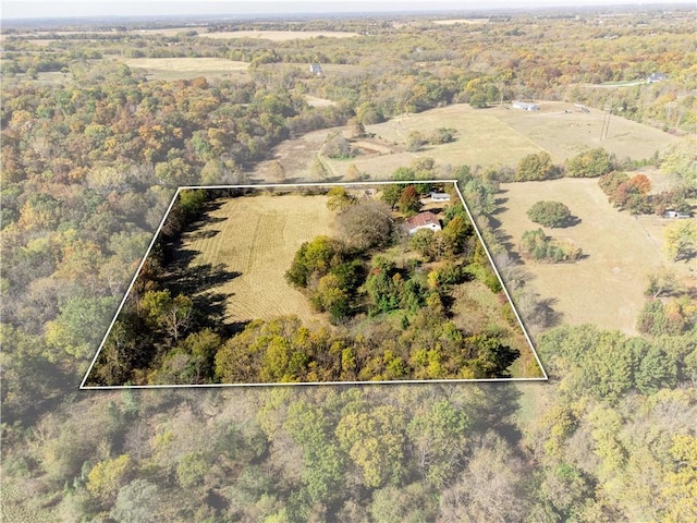 birds eye view of property with a rural view