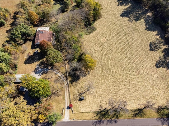 birds eye view of property with a rural view