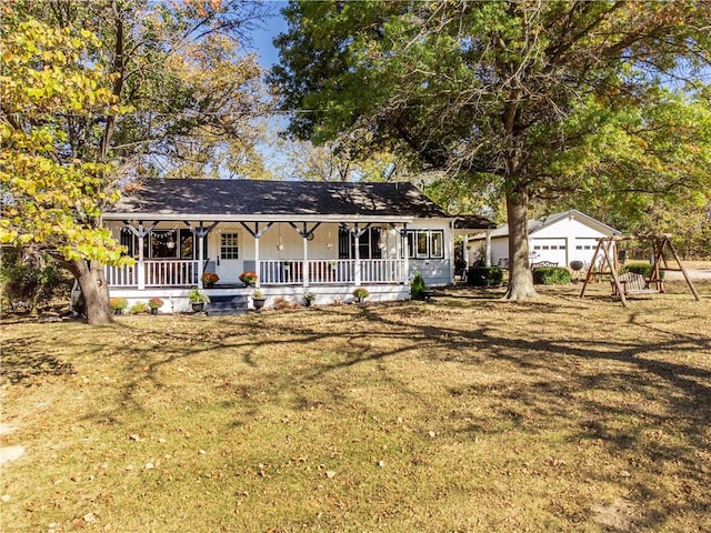 view of front facade with an outdoor structure, a porch, and a front yard