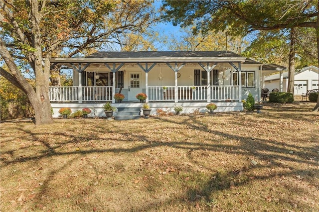farmhouse with a porch and a front lawn