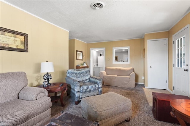 carpeted living room with visible vents and ornamental molding