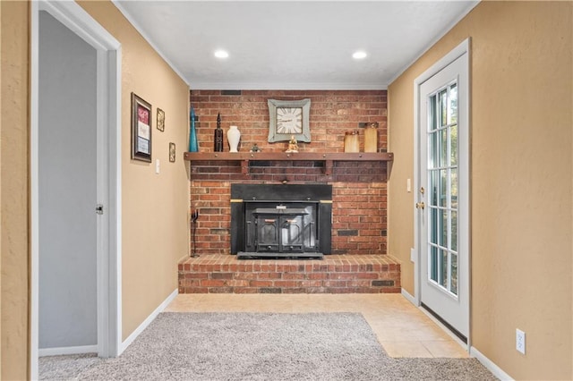 living room with a fireplace, carpet, and ornamental molding