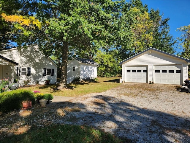 exterior space with an outdoor structure and a garage