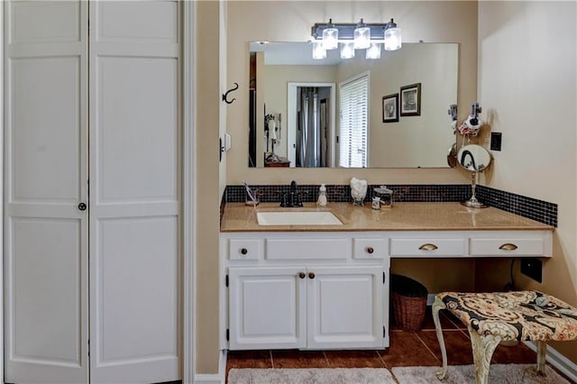 bathroom featuring tile patterned flooring and vanity