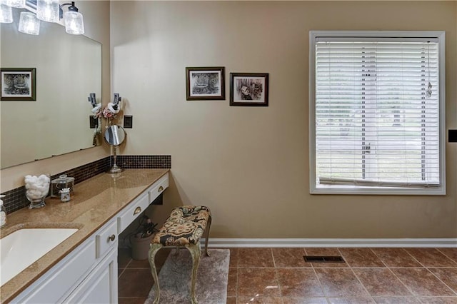 bathroom featuring vanity, tile patterned floors, and a wealth of natural light