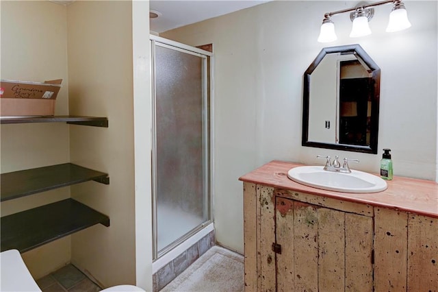 bathroom featuring vanity, tile patterned flooring, and an enclosed shower