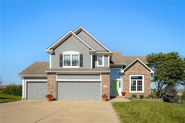 craftsman inspired home with a front yard and a garage