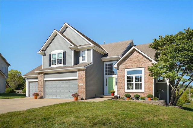 view of front of property with a front yard and a garage