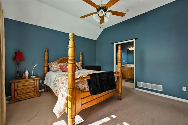 bedroom featuring carpet floors, vaulted ceiling, ceiling fan, and ensuite bathroom