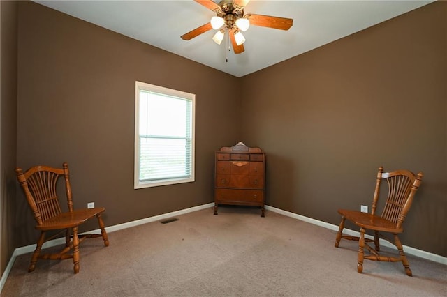 sitting room featuring carpet flooring and ceiling fan