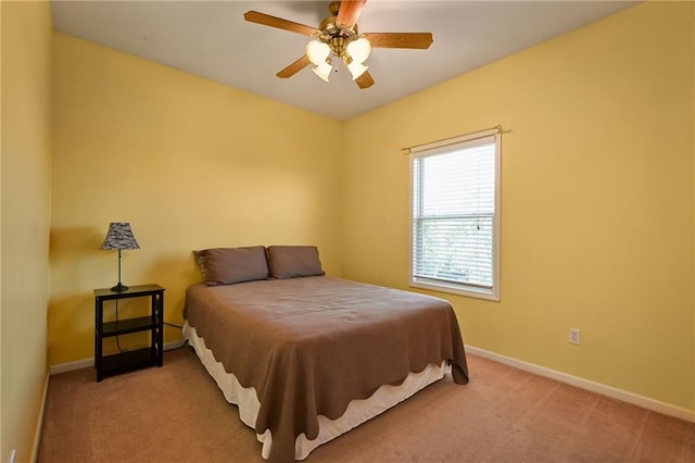 bedroom featuring ceiling fan and light colored carpet