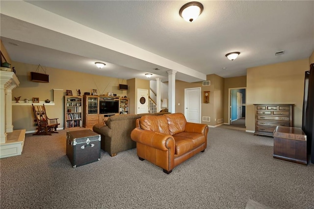 living room featuring decorative columns and carpet flooring