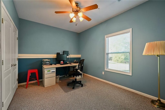 carpeted home office with ceiling fan