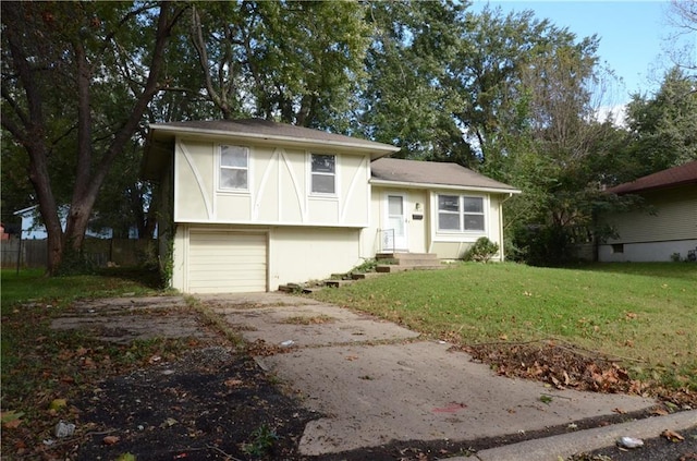 view of front of property featuring a garage and a front lawn