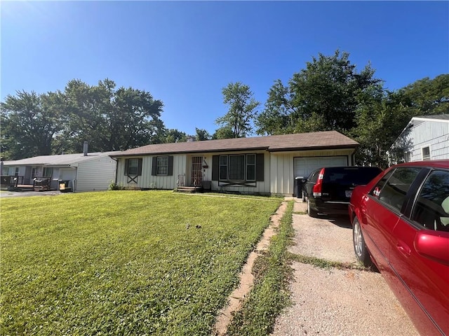 single story home with a front lawn and a garage