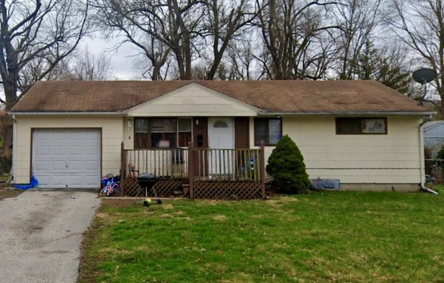 ranch-style home with a front lawn and a garage