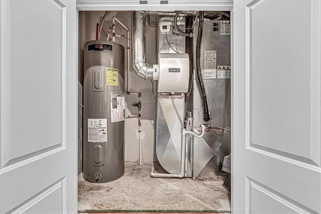 utility room featuring electric water heater