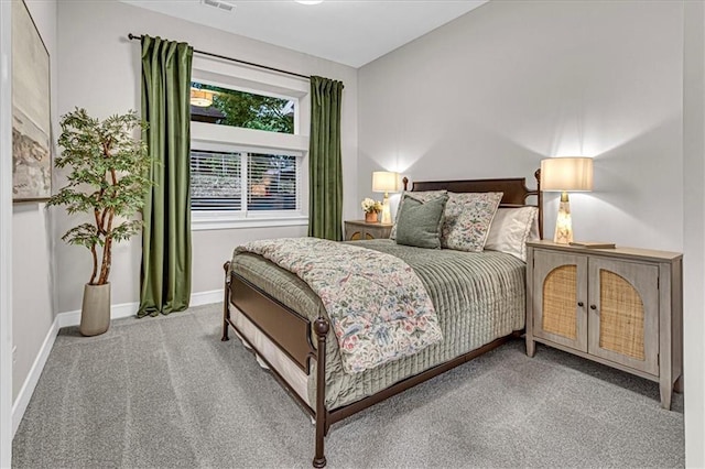 bedroom featuring light colored carpet