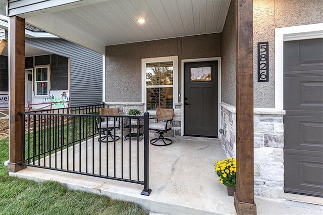 5830 Hunter Ct, Raytown, MO 64133 - entrance to property featuring stone siding and stucco siding