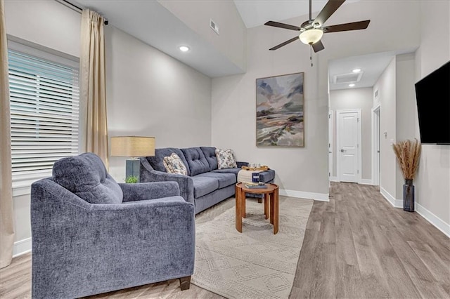 5830 Hunter Ct, Raytown, MO 64133 - living room featuring a ceiling fan, visible vents, wood finished floors, attic access, and baseboards