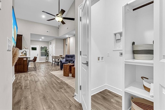 5830 Hunter Ct, Raytown, MO 64133 - corridor featuring baseboards, wood finished floors, and lofted ceiling