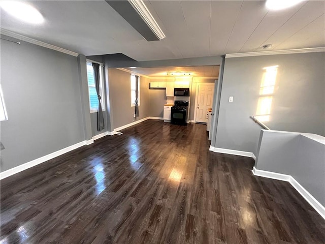 unfurnished living room with dark hardwood / wood-style floors and ornamental molding