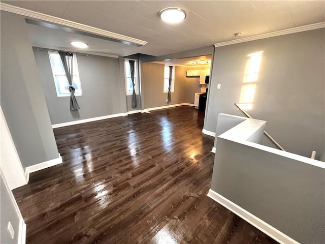 interior space featuring dark hardwood / wood-style flooring and ornamental molding