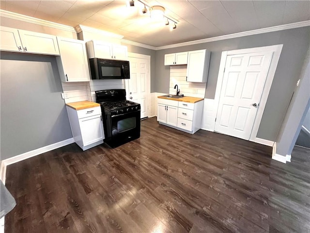 kitchen featuring white cabinets, black appliances, and wood counters