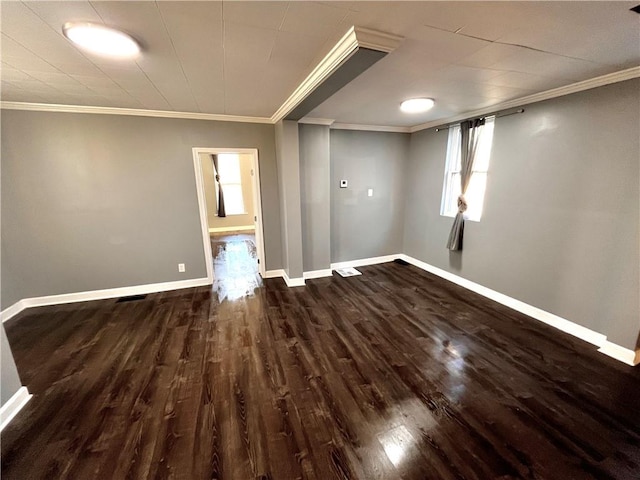 unfurnished room with dark hardwood / wood-style floors and crown molding