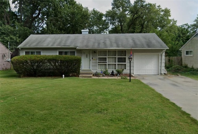 single story home featuring a garage and a front yard