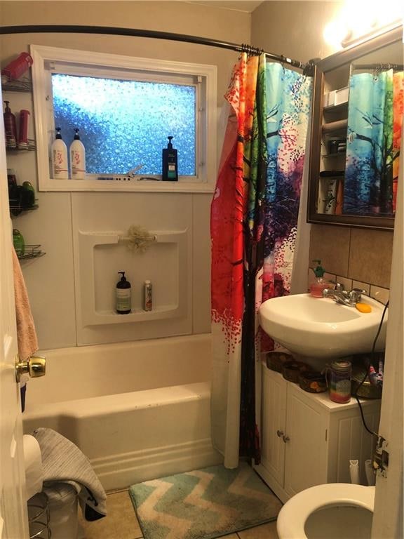 full bathroom with toilet, shower / tub combo with curtain, and vanity