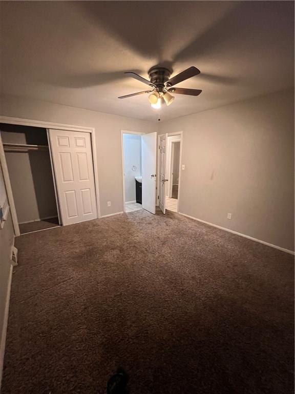 unfurnished bedroom featuring ceiling fan, a closet, and carpet