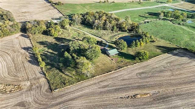 birds eye view of property with a rural view and a water view