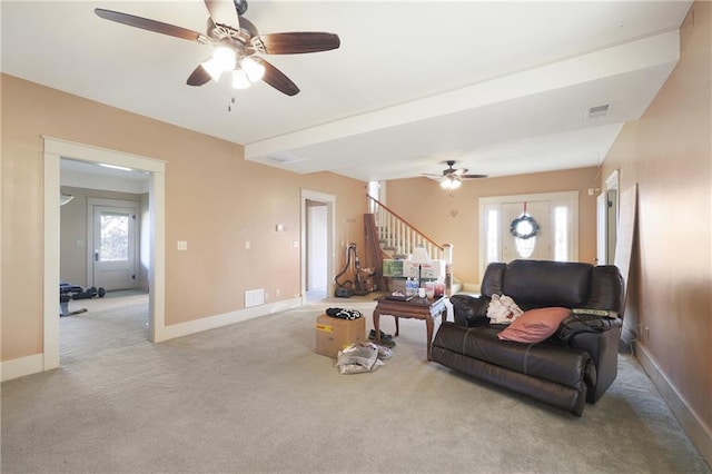 living room featuring light carpet and ceiling fan