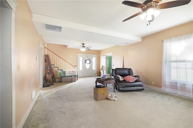 carpeted living room featuring ceiling fan