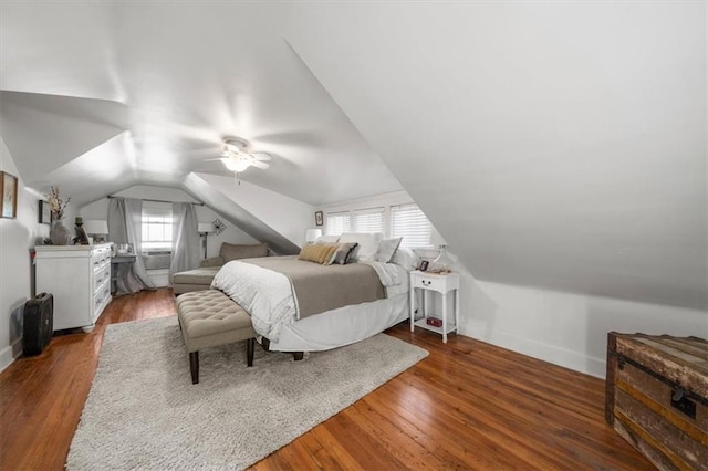 bedroom with lofted ceiling, dark hardwood / wood-style flooring, and ceiling fan