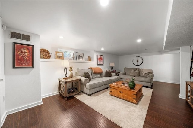 living room with dark hardwood / wood-style flooring