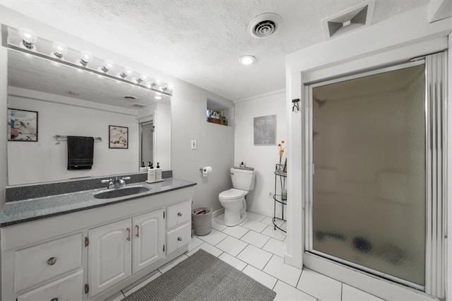 bathroom with tile patterned flooring, a textured ceiling, a shower with shower door, vanity, and toilet