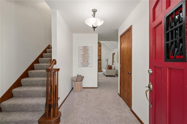 3438 N 123rd St, Kansas City, KS 66109 - entryway featuring carpet floors, baseboards, and stairway